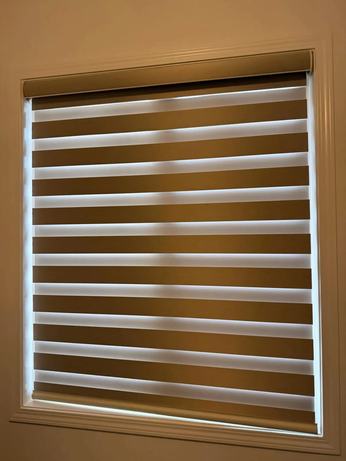 Warm-toned zebra blind installed in a Milton home