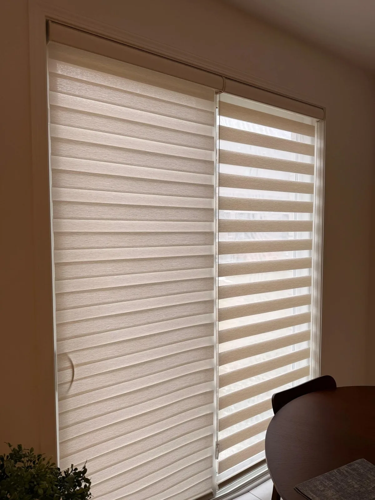 Pair of custom zebra blinds installed beside a Milton dining area
